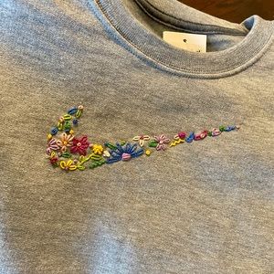 hand embroidered nike swoosh on grey crewneck
